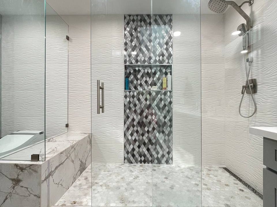 Curbless walk-in shower with porcelain tile and glass enclosure